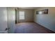 Cozy bedroom with plush carpet, neutral paint, and natural light at 10105 E Cactus Rd, Scottsdale, AZ 85260