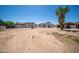 Expansive property featuring tile roof, desert landscape, porte-cochere, and a circular tower entryway at 10105 E Cactus Rd, Scottsdale, AZ 85260