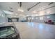 Expansive garage featuring car lifts, office space, and abundant storage for any car collector at 10105 E Cactus Rd, Scottsdale, AZ 85260