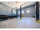 The expansive garage features lifts, ample room for vehicles, and a work area at 10105 E Cactus Rd, Scottsdale, AZ 85260