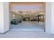 Large garage with high ceilings, car lifts, and space for multiple vehicles, perfect for car enthusiasts at 10105 E Cactus Rd, Scottsdale, AZ 85260