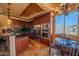 Features a gourmet kitchen with stainless steel appliances, granite countertops, and custom wood cabinetry at 10105 E Cactus Rd, Scottsdale, AZ 85260