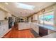 Spacious kitchen open to the living area, featuring an island, and a large window with a view at 10105 E Cactus Rd, Scottsdale, AZ 85260