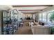 Spacious living room featuring beamed ceilings and lots of natural light at 10105 E Cactus Rd, Scottsdale, AZ 85260