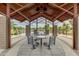 Under the community pergola, the seating arrangement is an ideal place to meet and greet at 10156 E Radiant Ave, Mesa, AZ 85212