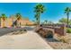 Welcoming visitor and community center entrance with desert landscaping and clear blue skies on a sunny day at 10156 E Radiant Ave, Mesa, AZ 85212
