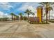 Eastmark Home Finding Center entrance with palm trees and desert landscaping at 10156 E Radiant Ave, Mesa, AZ 85212