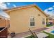 Exterior view of home with stucco siding, tile roof, and artificial grass at 10156 E Radiant Ave, Mesa, AZ 85212