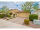 Charming two-story home featuring a two-car garage, paver driveway, and desert landscaping at 10156 E Radiant Ave, Mesa, AZ 85212