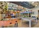 Fun game room with foosball, pool tables, and playful decor offering residents a space for recreation and relaxation at 10156 E Radiant Ave, Mesa, AZ 85212