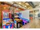 Resident game room with basketball arcade games, vending machines, and arcade games at 10156 E Radiant Ave, Mesa, AZ 85212