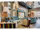 Vibrant lounge area with plush sofas, patterned chairs, and stylish lighting, offering a comfortable gathering space at 10156 E Radiant Ave, Mesa, AZ 85212