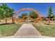 Community playground with modern play equipment, climbing nets, and open green spaces at 10156 E Radiant Ave, Mesa, AZ 85212