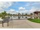 Picturesque community pond with a scenic bench overlooking the water and lush landscaping at 10156 E Radiant Ave, Mesa, AZ 85212