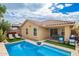 Backyard oasis with a refreshing pool, patio area, and lush landscaping at 10156 E Radiant Ave, Mesa, AZ 85212