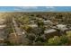 Expansive aerial shot of a neighborhood showcasing tree-lined streets and a mix of cozy homes and townhouses at 102 W Almeria Rd, Phoenix, AZ 85003