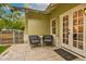 A cozy back patio with two chairs, leading to a door for indoor/outdoor enjoyment at 102 W Almeria Rd, Phoenix, AZ 85003