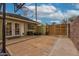 Private backyard area featuring a basketball hoop, an enclosed block wall, and a convenient double-door entrance at 102 W Almeria Rd, Phoenix, AZ 85003