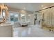 Bright bathroom featuring a clawfoot tub, dual vanity, and marble shower with glass enclosure at 102 W Almeria Rd, Phoenix, AZ 85003