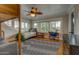 Cozy bedroom offering ample natural light, a ceiling fan, a desk, and a built-in bunk bed at 102 W Almeria Rd, Phoenix, AZ 85003