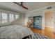 Well-lit bedroom featuring stylish wooden floors, ample storage space, and cozy decor at 102 W Almeria Rd, Phoenix, AZ 85003