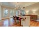 Well-lit dining room with hardwood floors, view of backyard, and modern light fixture at 102 W Almeria Rd, Phoenix, AZ 85003