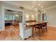 Open dining room with hardwood floors, view of living room, and stylish lighting at 102 W Almeria Rd, Phoenix, AZ 85003
