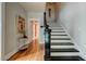 Inviting entryway with hardwood floors, a staircase, and decorative accents, creating a warm welcome at 102 W Almeria Rd, Phoenix, AZ 85003