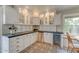 Elegant kitchen with custom cabinetry, wine cooler, and designer flooring, creating a sophisticated space at 102 W Almeria Rd, Phoenix, AZ 85003