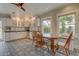Eat-in kitchen with ample storage, cozy breakfast nook with seating, and views of the backyard at 102 W Almeria Rd, Phoenix, AZ 85003
