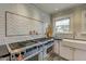 Close up of a kitchen area featuring a stainless steel stove with tile backsplash at 102 W Almeria Rd, Phoenix, AZ 85003