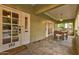 Inviting front porch with a dining table, an outdoor light fixture, and great natural light at 102 W Almeria Rd, Phoenix, AZ 85003