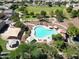 Aerial view showcases a community pool, spa, playground, green spaces and walking paths at 1059 S Cheshire Ln, Gilbert, AZ 85296