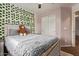Cozy bedroom with white sliding closet doors, and ivy decor at 1059 S Cheshire Ln, Gilbert, AZ 85296