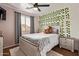 Cozy bedroom featuring a plush bed, decorative lights, and a large window at 1059 S Cheshire Ln, Gilbert, AZ 85296