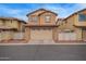 Inviting two story home with a two car garage and desert landscaping at 1059 S Cheshire Ln, Gilbert, AZ 85296