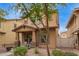 Charming two-story home with covered porch and desert landscaping at 1059 S Cheshire Ln, Gilbert, AZ 85296