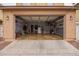 Spacious two car garage features shelving for ample storage and easy access at 1059 S Cheshire Ln, Gilbert, AZ 85296