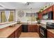 Well-lit kitchen featuring stainless steel appliances, stylish countertops, and backsplash at 1059 S Cheshire Ln, Gilbert, AZ 85296