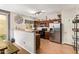 Well-lit kitchen featuring a stainless steel refrigerator, oven and stylish countertops at 1059 S Cheshire Ln, Gilbert, AZ 85296