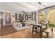 Open-concept living area with large sectional, dining table, and plenty of natural light at 1059 S Cheshire Ln, Gilbert, AZ 85296