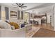 Open-concept living area with large sectional, dining table, and view to kitchen at 1059 S Cheshire Ln, Gilbert, AZ 85296