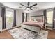 Large main bedroom suite featuring a plush bed and lots of natural light at 1059 S Cheshire Ln, Gilbert, AZ 85296