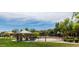 Community park with basketball court, covered picnic area, seating and lush greenery at 1059 S Cheshire Ln, Gilbert, AZ 85296