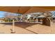 Community playground featuring shaded climbing structure and rock wall at 1059 S Cheshire Ln, Gilbert, AZ 85296