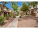 Serene community street view with lush landscaping and well-maintained homes at 1059 S Cheshire Ln, Gilbert, AZ 85296