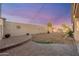 Spacious backyard featuring desert landscaping, brick accents and decorative brick wall at 10772 W Woodland Ave, Avondale, AZ 85323