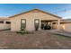 Well-maintained backyard with patio area and privacy wall surround at 10772 W Woodland Ave, Avondale, AZ 85323