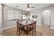 Bright dining area boasts tile flooring and access to a patio, perfect for entertaining at 10772 W Woodland Ave, Avondale, AZ 85323