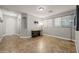 An open living room has tile flooring and neutral colored walls at 10772 W Woodland Ave, Avondale, AZ 85323